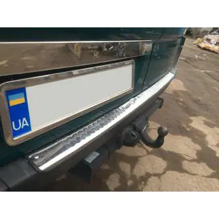 Stainless steel trim above license plate photo 3