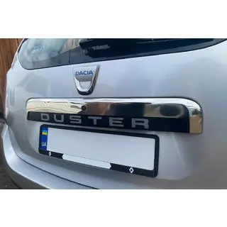 Upper stainless steel trim above license plate photo 1