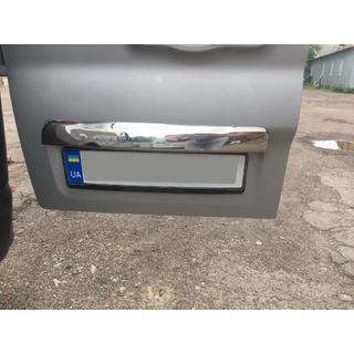 Stainless steel trim above license plate photo 1